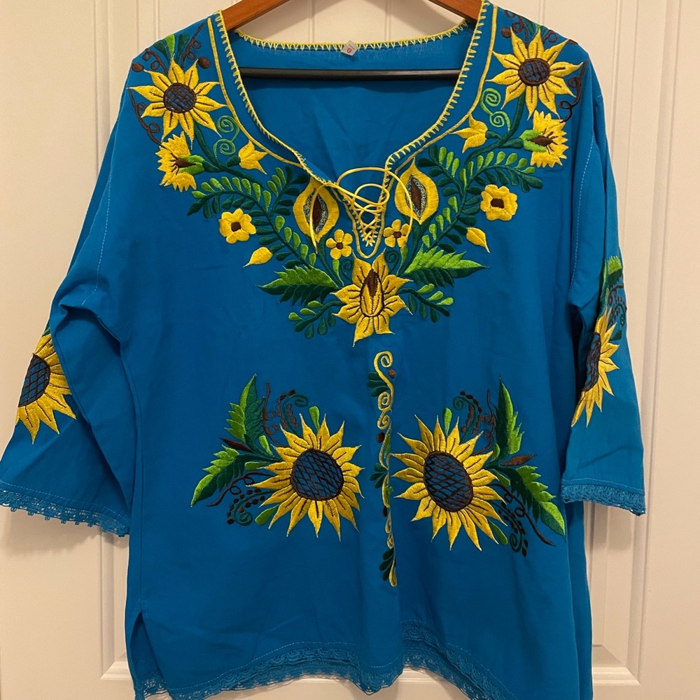 Handmade Embroidered floral blouse .